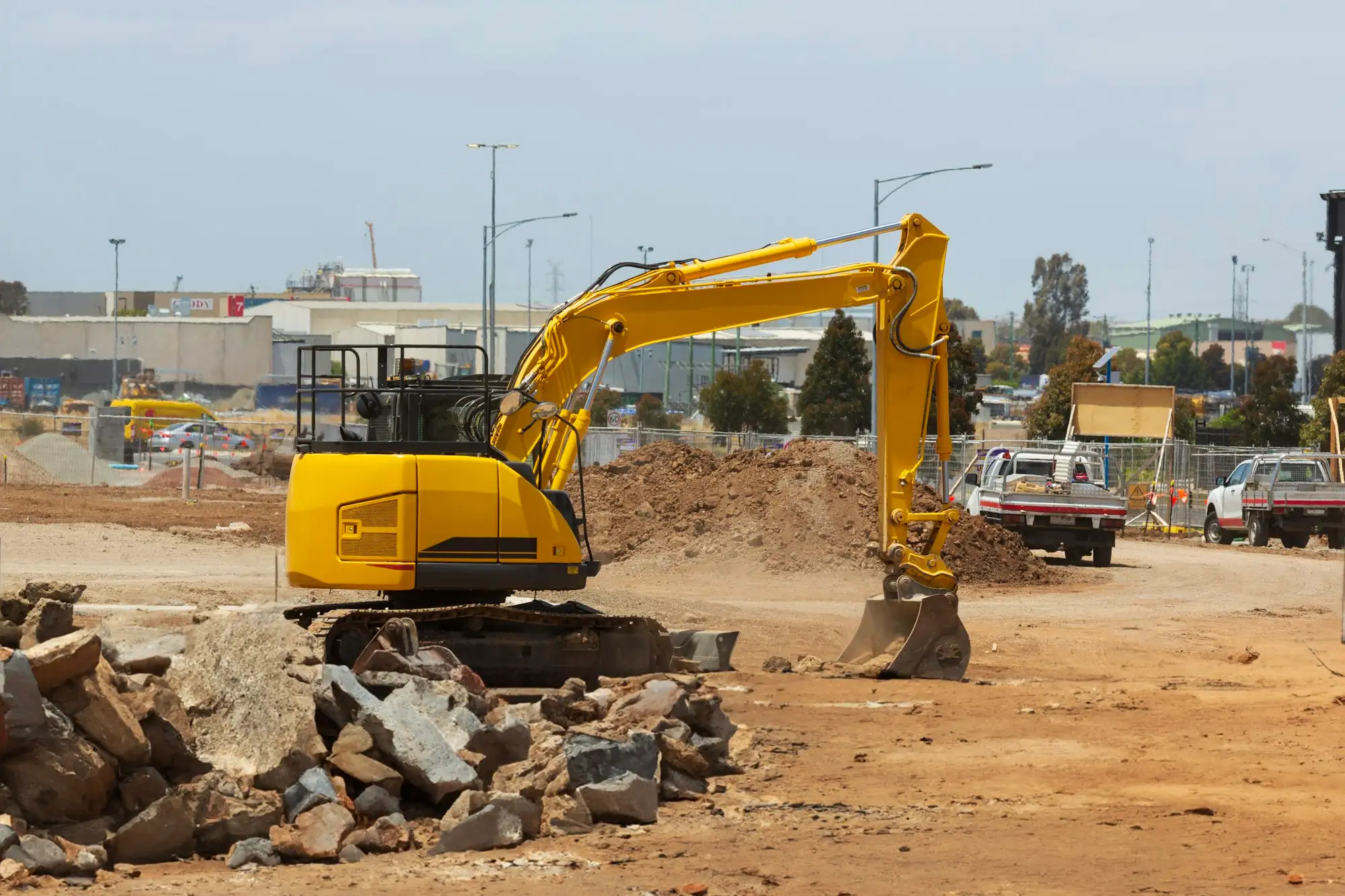 Excavator clearing a residential lot ready for a new build