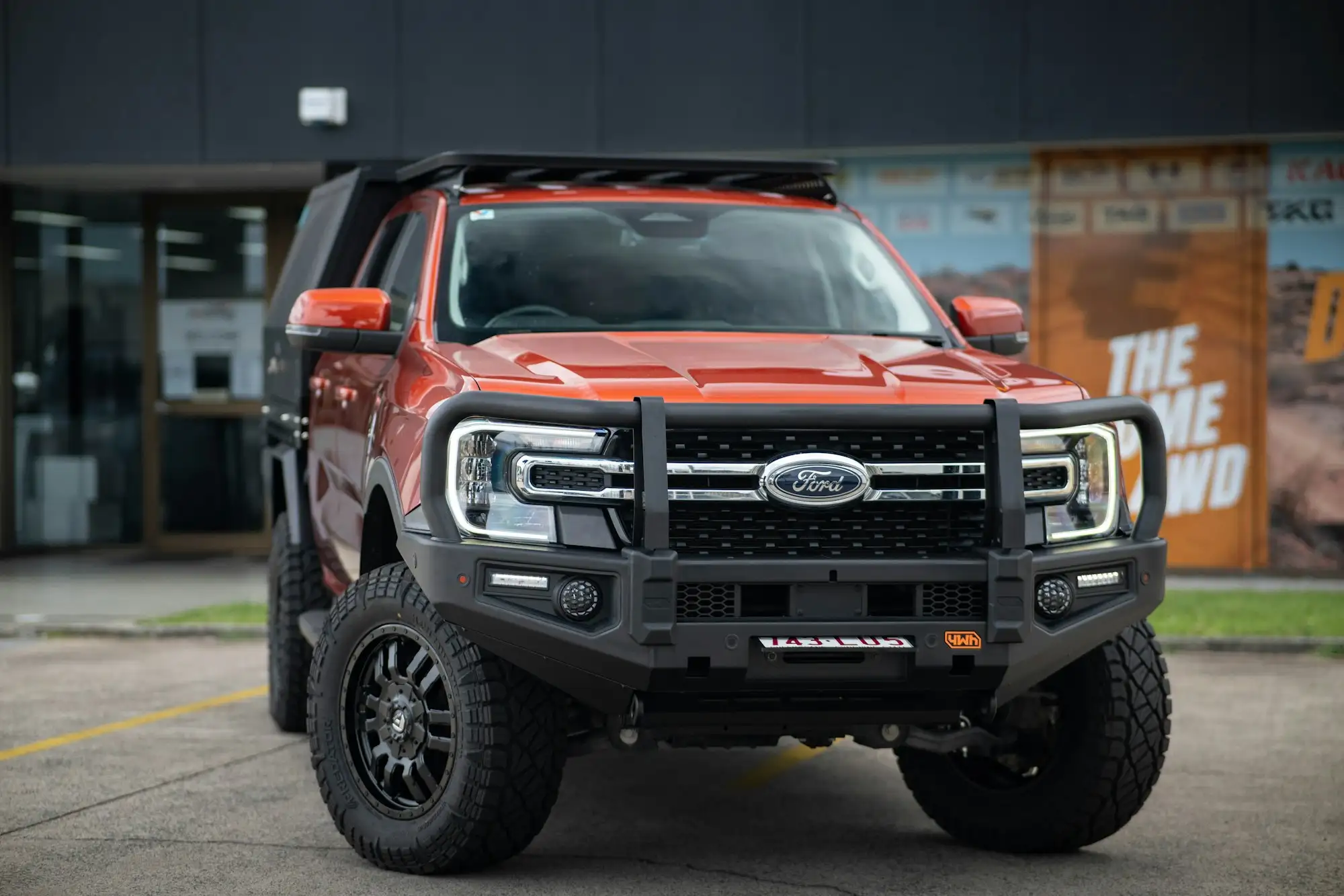 Work ute with a bullbar parked outside an Australian job site