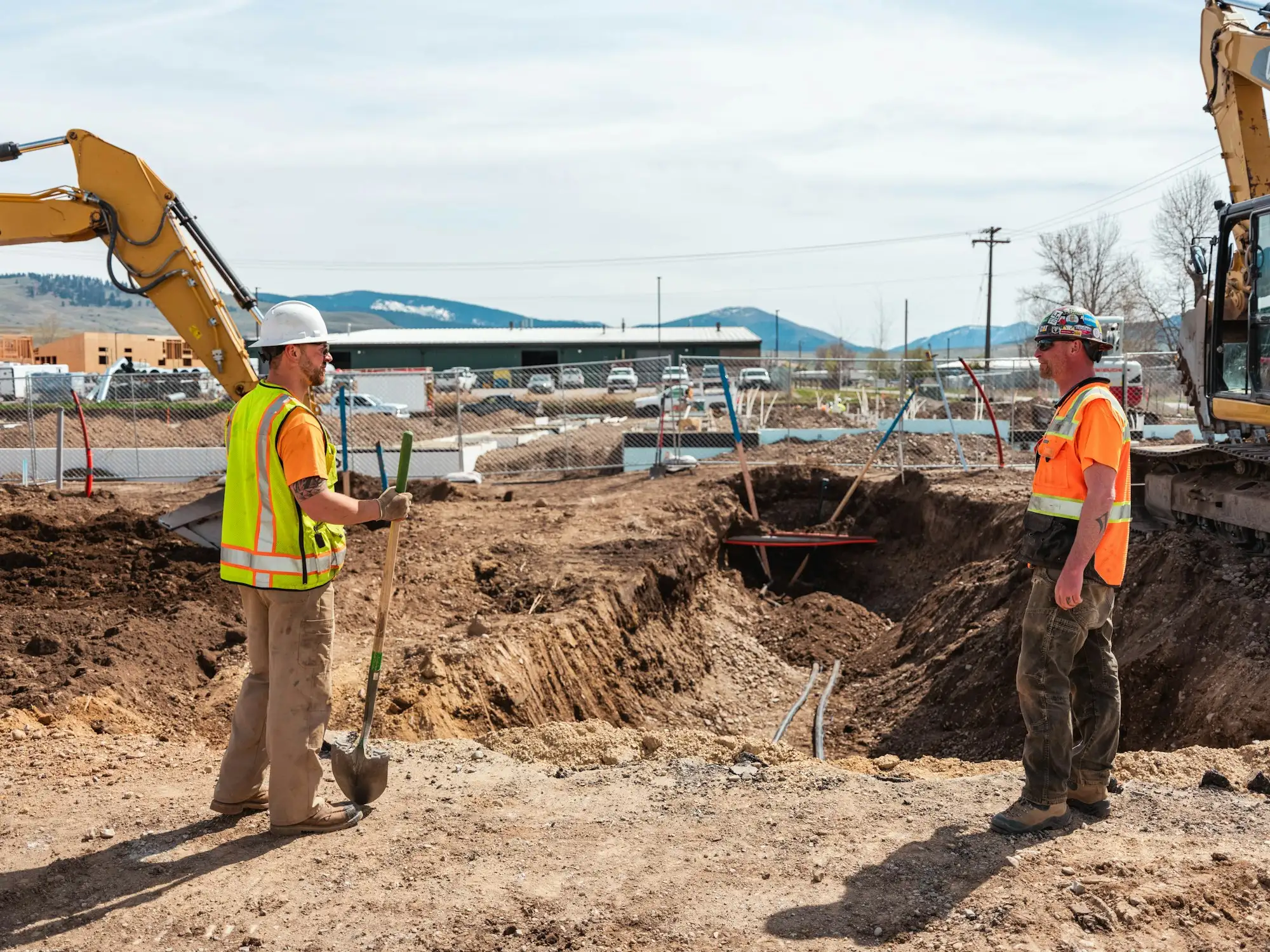 Site workers in safety vests on an Australian construction site