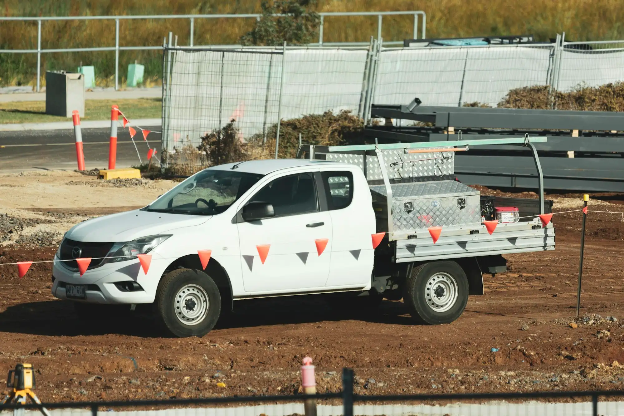White work ute parked on an Australian construction site
