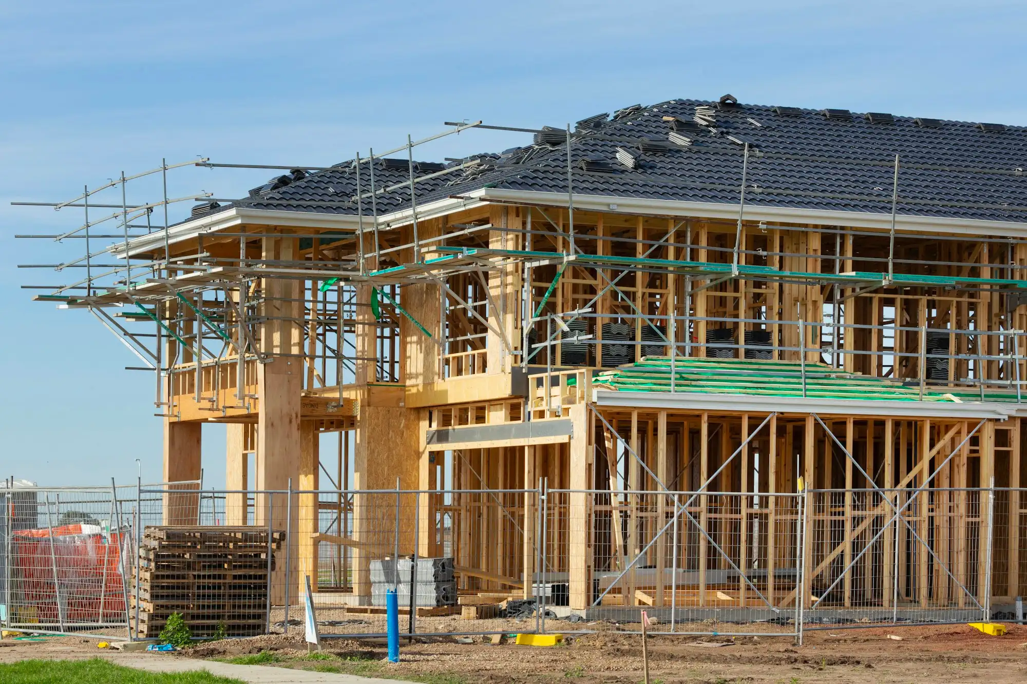 Two storey home under construction with scaffolding on an Australian building site